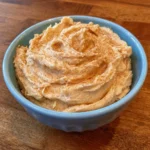 Texas Roadhouse-style butter spread on warm dinner rolls.